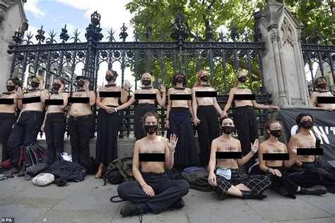 Topless Extinction Rebellion Activists Padlock Themselves To The Gates