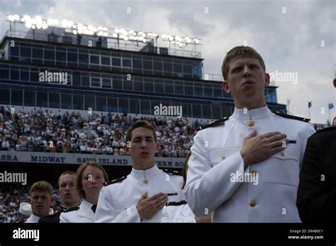 us navy newly commissioned ensigns and second lieutenants sing the u s naval academy alma mater