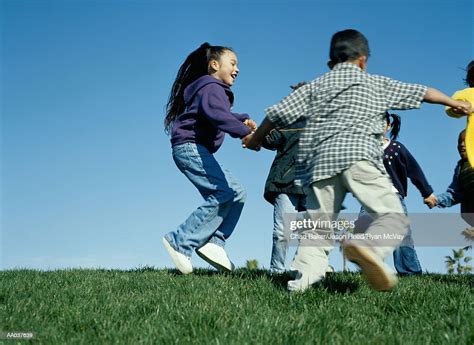 Children Playing Ringaroundtherosy High Res Stock Photo Getty Images