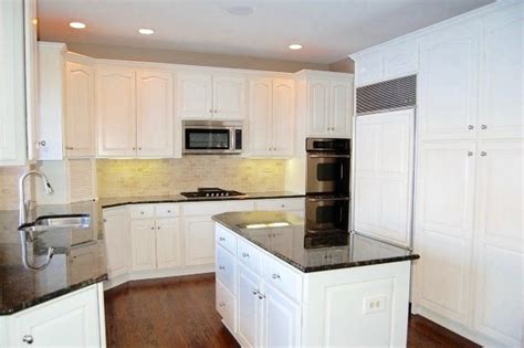 What company is the real #1 wood refinisher in the world? After Photo -Oak Cabinets in Kitchen Refinished White ...