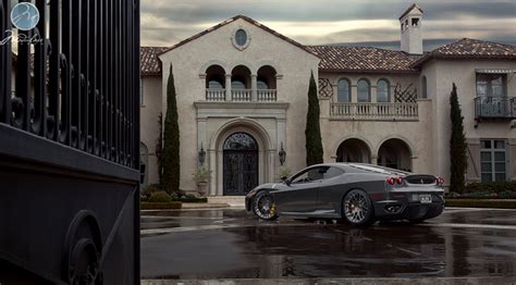 A Look At Some Mansions With Expensive Cars Parked In Front Homes Of