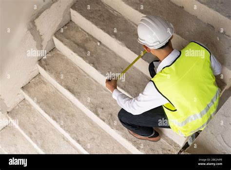 Inspector Checking Stair Width Building For Renovation Engineer