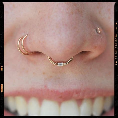 Double Nose And Septum Piercing