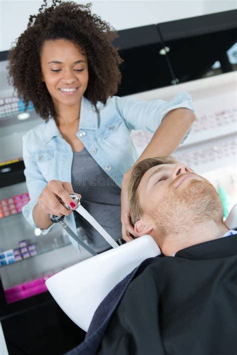 Male Beautician Pointing Out Area On Leg Stock Photo Image Of