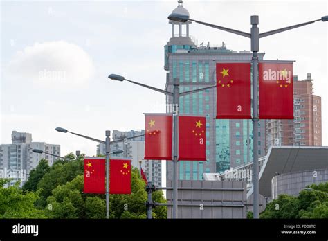 Pairs Of Chinese National Flags On Lamp Posts On Peoples Avenue In