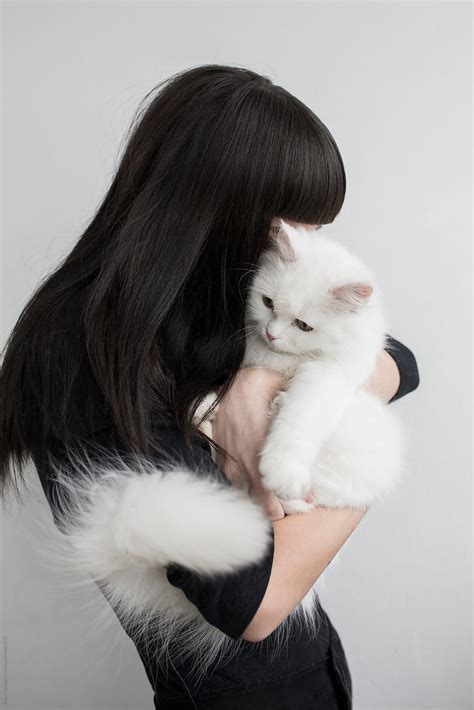 Young Woman Holding Beautiful Persian Cat By Stocksy Contributor