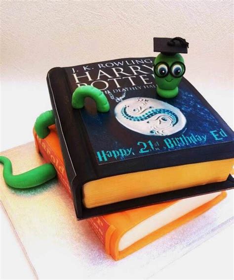 Two Stacked Books With A Cute Bookworm Top Cake Is Chocolate And The