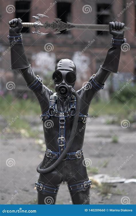 Adult Kinky Man Dressed In Fetish Latex Rubber Costume With Kinky Mask