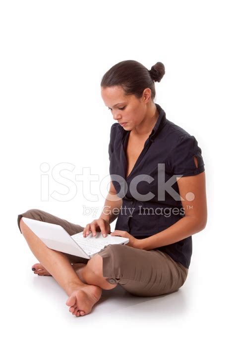 Young Woman With Laptop Sitting Cross Legged On Floor Stock Photos
