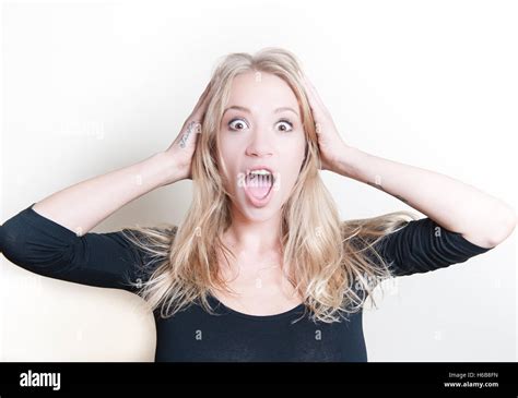 Young Beautiful Blond Woman Astonished Stunned Portrait Hands On Head