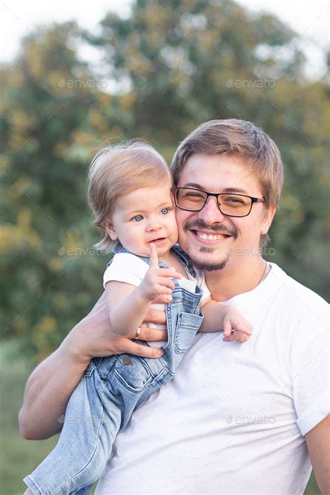 Dad Holds Daughter In His Arms And Hugs Stock Photo By Lulu8206 Photodune