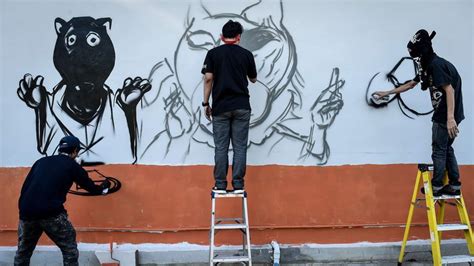 Thai Graffiti Artists Paint Murals Of Panthers At Public Places To