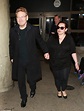 Kenneth Branagh leads wife Lindsay Brunnock by the hand at LAX airport ...