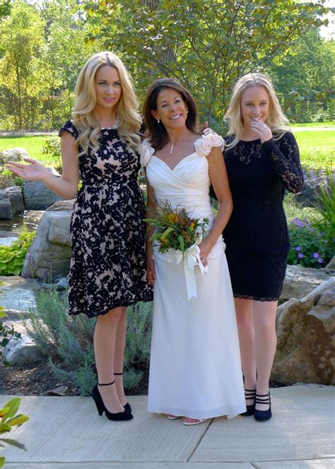 a bride and her daughters taking wedding photos in the gardens bride bridesmaid wedding dresses