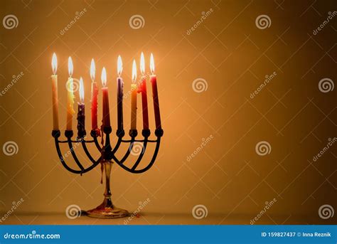 Hanukkah Holiday Menorah With Variety Of Colorful Lit Candles Stock