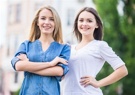 Premium Photo Portrait Of Two Beautiful Young Women Looking At Camera