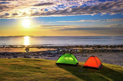 Camping At Sunset With Tents On Uttakleiv Beach In Lofoten Islands