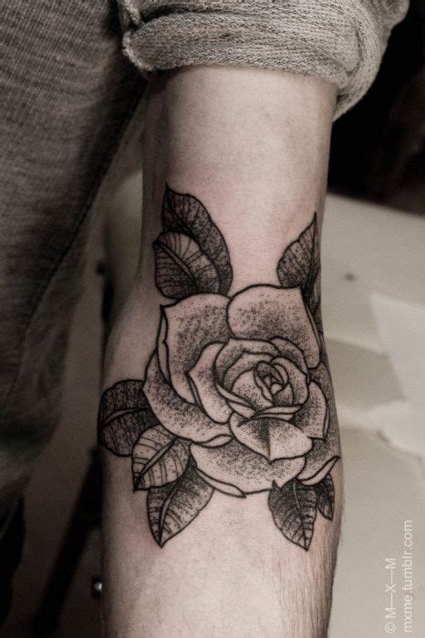 It can be a small tattoo or a good size tattoo like the photo above. Black cute rose tattoo on arm