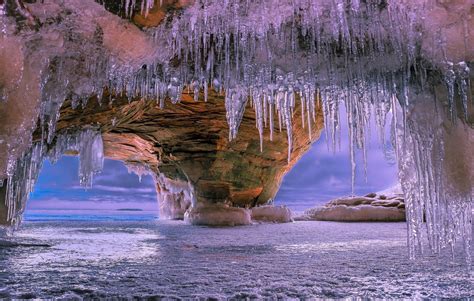 Icicles In Beach Cave In Winter Hd Wallpaper Background Image