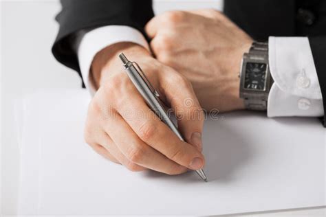 Businessman Writing Something On The Paper Stock Image Image Of
