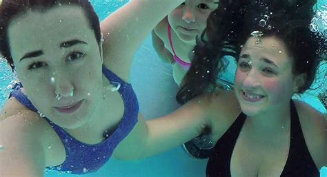 Girls Swimming In The Pool Underwater