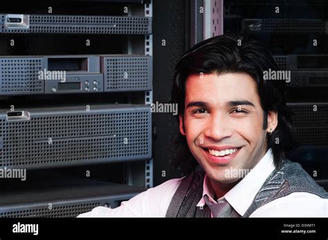 Networking Engineer Smiling In A Server Room Stock Photo Alamy
