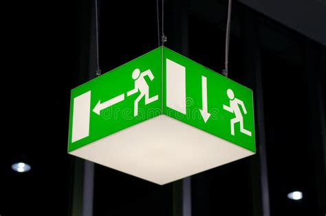 Illuminated Green Emergency Exit Sign Stock Image Image Of