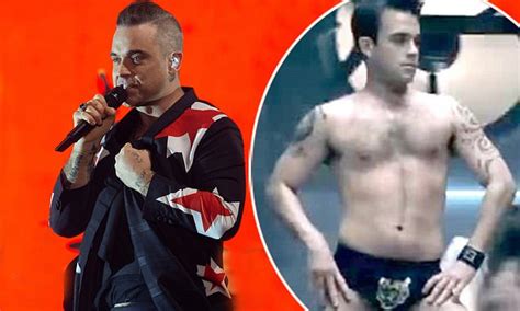 Robbie Williams Slips Back Into Those Famous Tiger Print Pants From