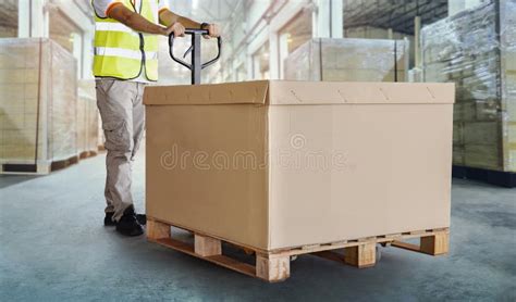 Workers Unloading Cargo Boxes On Pallets In Warehouse Cartons Cardboard Boxes Shipping