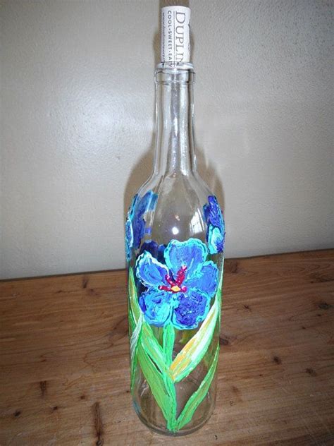 Some wine bottles have interesting labels. Clear Painted Wine Bottle With Cork Spring Flowers Wedding ...