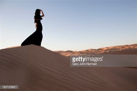 women in the uae wear a long black robe called the abaya with a hijab abaya fotografie oasis