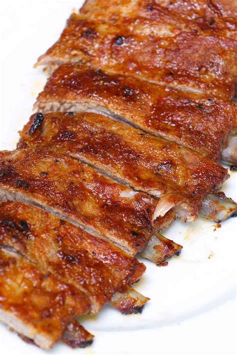Perfectly Cooked Spare Ribs With The Bone Sticking Out A Half Inch From