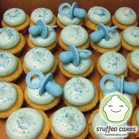 Buy scrapbook paper in patterns and colors to match the theme of the baby shower. Stuffed Cakes: Baby Shower Mini Cupcakes