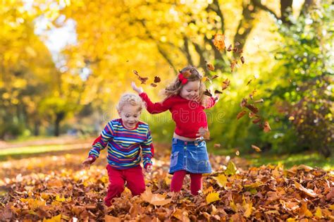 Kids Playing In Autumn Park Stock Photo - Image of germany ...