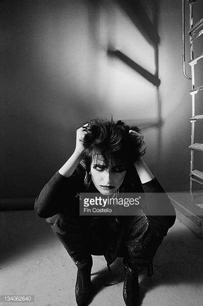 siouxsie sioux lead singer with british punk band siouxsie and the banshees posed crouching in a
