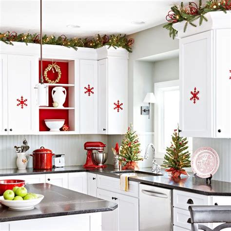 Christmas in the kitchen with mini wreaths on cabinet doors. 5 Tips to Decorate Your Kitchen for Any Holiday | The Lakeside Collection