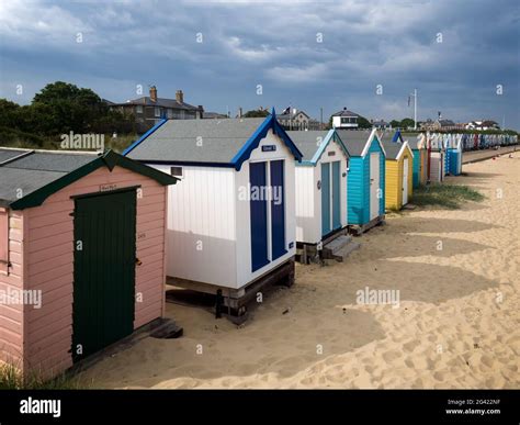 A Row Of Brightly Coloured Beach Huts In Southwold Stock Photo Alamy
