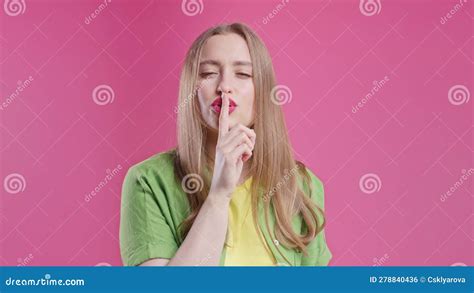 Smiling Pretty Woman With Finger On Lips Shhh Secret Silence Pink