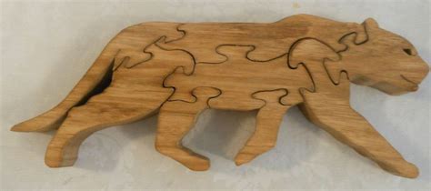 A Wooden Puzzle With A Dog Made Out Of Wood