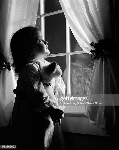 Girl Looking Out Window Night Photos And Premium High Res Pictures Getty Images