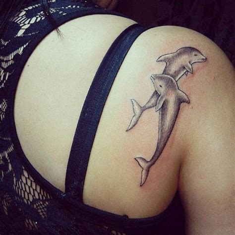 Cute Cartoon Like Colored Dolphins Tattoo On Shoulder Tattooimagesbiz