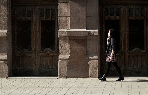 Young Woman Walking On The Street Del Colaborador De Stocksy Alexey