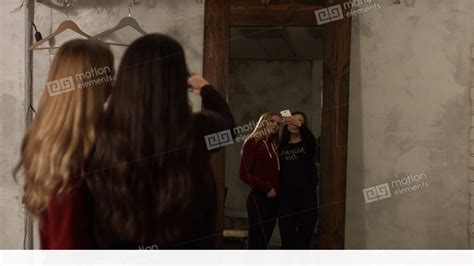 Reflection Of Cute Girls Taking Selfie In Mirror Stock Video Footage