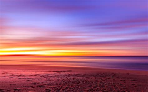 3840x2400 Purple Sky Beach Sunset Sand Footprints 4k Hd 4k Wallpapers