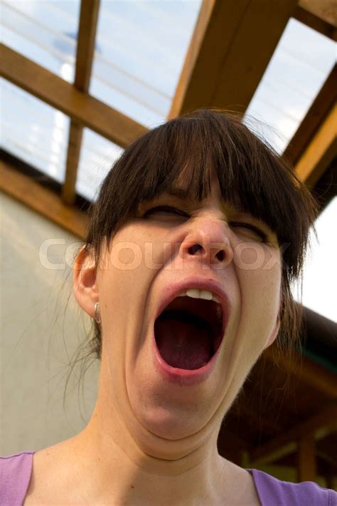 The Woman Yawns Widely Having Opened A Mouth Stock Image Colourbox