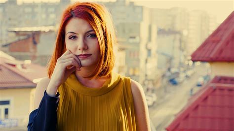 Super Slow Motion Of Redhead Woman Smiling To The Camera At The Sunset