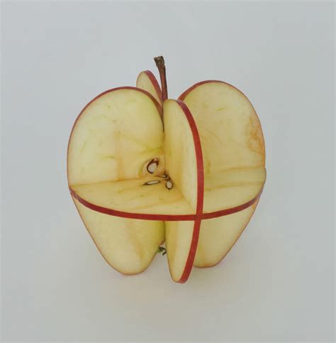 Thisiscolossal How Do You Like Them Apples Can Suns Playful Sculptures Emerge From Bright Red