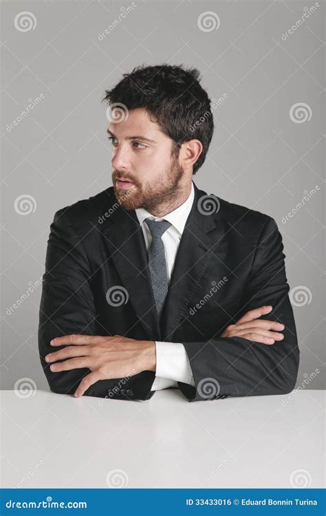 Portrait Of A Young Businessman Looking To The Side Stock Photo