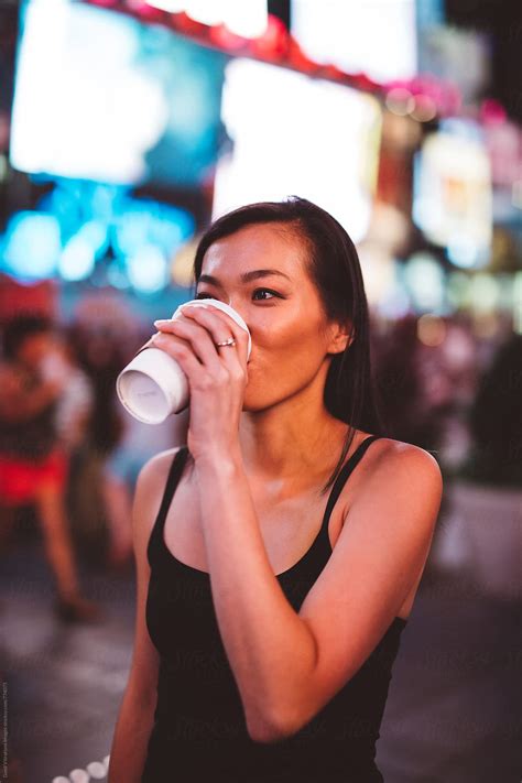 Asian Woman In Time Square In Nyc By Stocksy Contributor Vero Stocksy