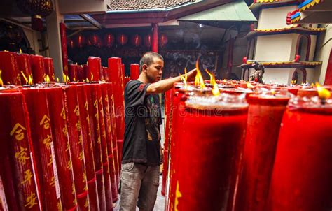 Large Red Candles Are Lit At The Temples To Celebrate Chinese New Year